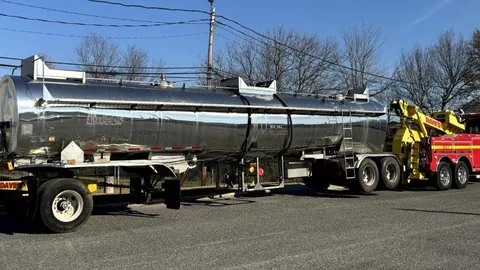 Dave's trucks with a tank trailer for dewatering equipment hauling