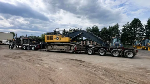 Excavator loaded on a lowboy trailer