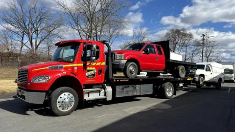 Dave's rollback hauling a pickup truck