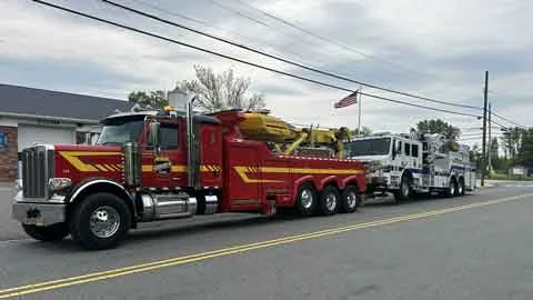 Dave's heavy duty rotator towing a fire truck