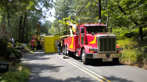 Dave's wrecker recovering a rolled over truck on a Central NJ road