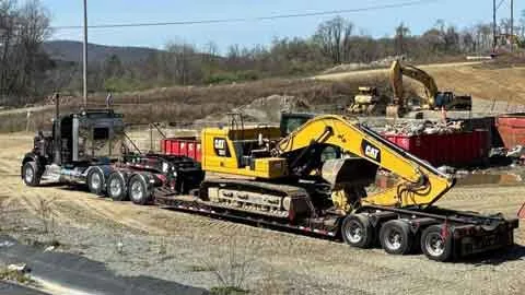 Dave's heavy hauler with a mini excavator and skid steer on the trailer