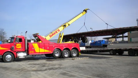 Dave's heavy wrecker lifting a trailer for bunking